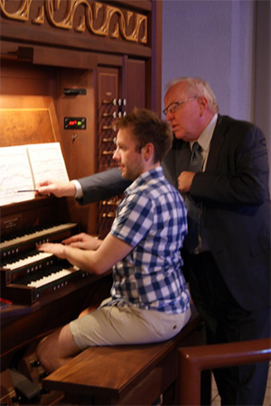 James Higdon teaching a student at an organ