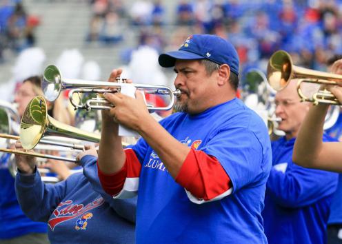 Alumni band members playing trumpets